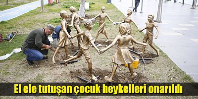 El ele tutuşan çocuk heykelleri onarıldı