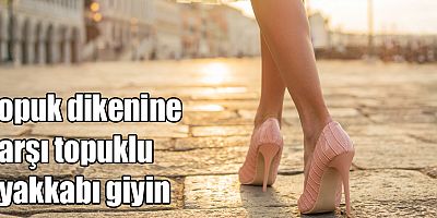 Topuk dikenine karşı topuklu ayakkabı giyin