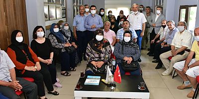 Tütüncü şehit aileleriyle hasret giderdi